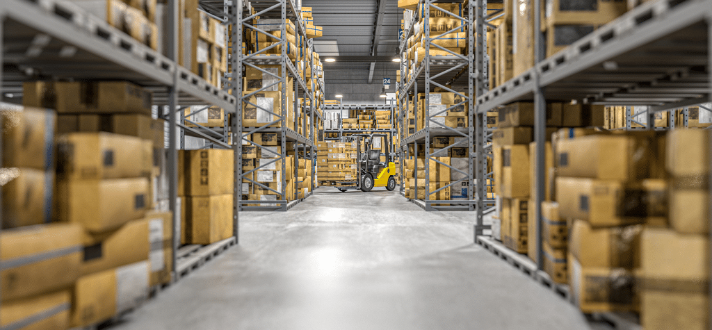a warehouse with many boxes in shelves